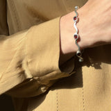 Sterling Silver Wavy Link Bracelet with Oval Garnet Stones