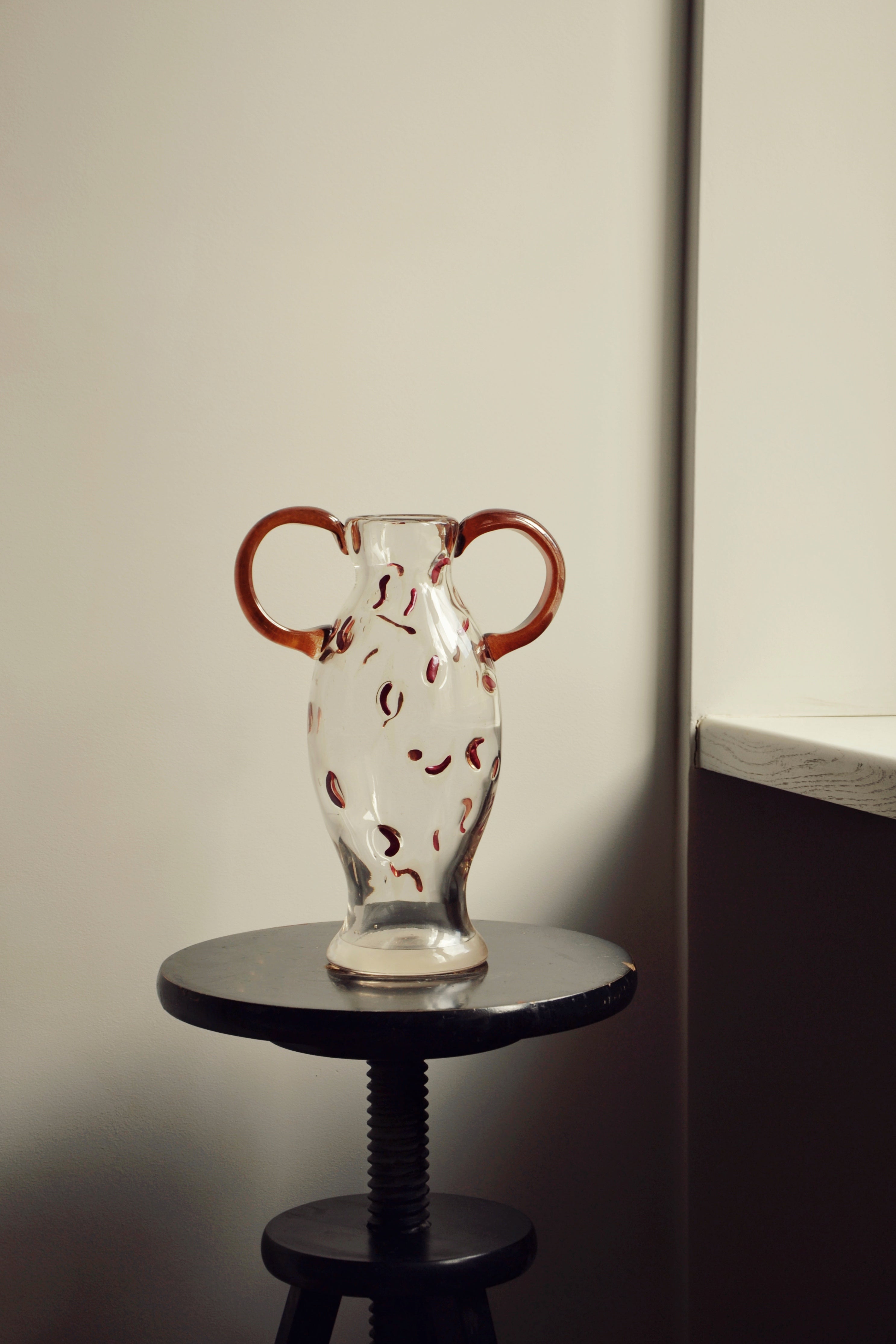 Discover the Modern Vintage Guta Glass Vase in Brown – a handcrafted consignment piece, featuring classic Guta glass craftsmanship with a rich, warm hue.