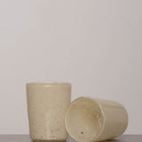Discover the YAKUSH Blur Glass – a 4.7" tall, 3.5" wide handcrafted drinking glass made from recycled eco-friendly materials, perfect for water or cocktails.