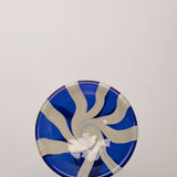 Discover the YAKUSH STRIPS Plate Blue – a 10.6" handcrafted double-walled plate made from recycled glass with bold cornflower blue stripes.