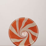 Discover the YAKUSH STRIPS Plate Orange – a 10.6" double-walled recycled glass plate with bold jam orange stripes, handcrafted by Ukrainian artisans.