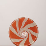 Discover the YAKUSH STRIPS Plate Orange – a 10.6" double-walled recycled glass plate with bold jam orange stripes, handcrafted by Ukrainian artisans.