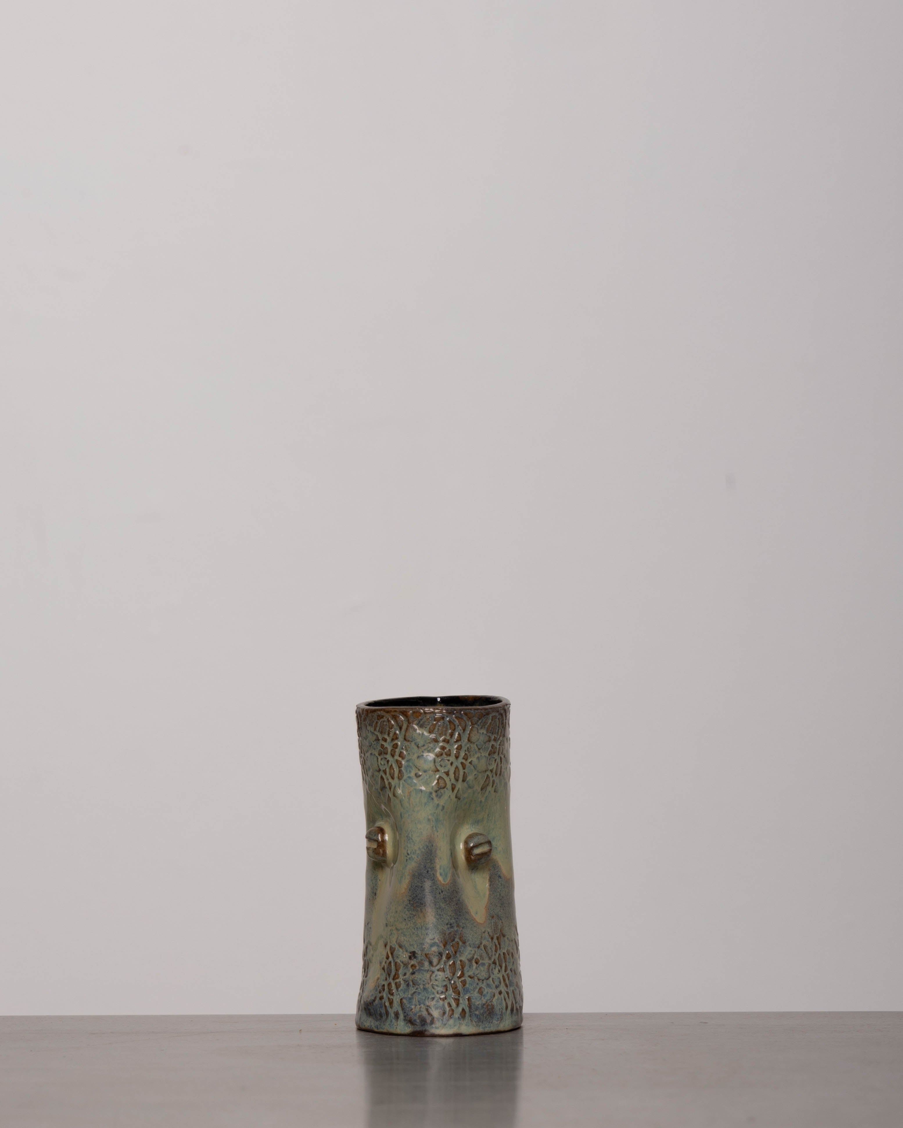 Discover the KKS Glass – a 5.5-inch tall, 3.5-inch wide handmade pottery glass with a 12oz capacity, featuring unique artisanal details.