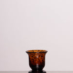 Discover the Vintage Leopard Vase – a rich amber-hued glass vase with a leopard-print pattern, perfect for classic and bold interior decor.