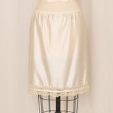 Ivory Nylon Slip Skirt with Tan Lace Trim and Side Slit