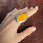 Vintage silver tone ring with large orange oval stone