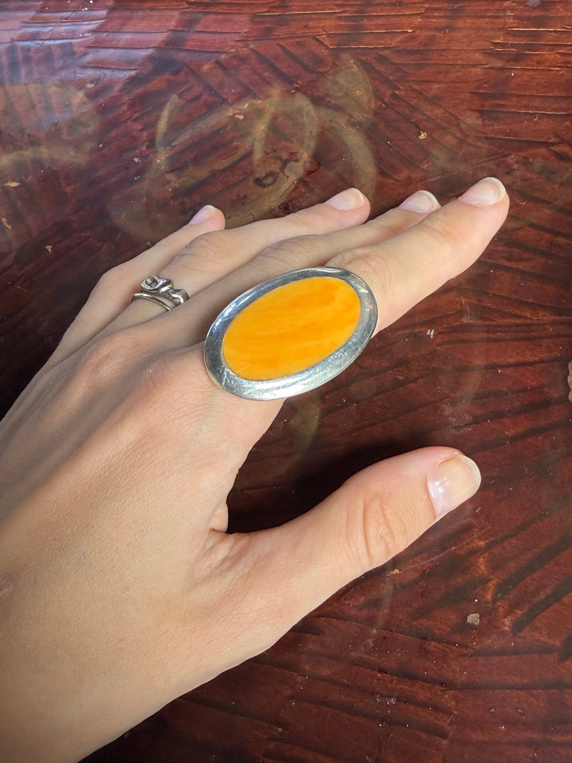 Vintage silver tone ring with large orange oval stone